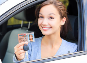 Female Driver Showing License