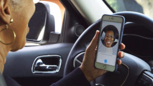 A Woman Using Uber app inside Car