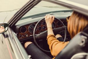 Lady Driving Vintage Car