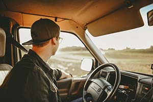 Young 25 year old driving a car