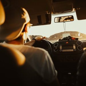 A teenager learning how to drive a car safely