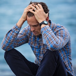 Man Touching His Hair Due to Depression