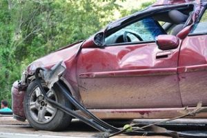 who covers a car crash damage in a no-fault state?